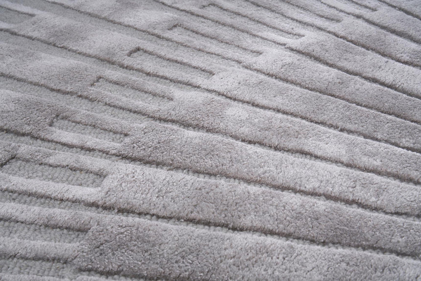 Radius Gray kerek gyapjú szőnyeg koncentrikus mintázata közelről